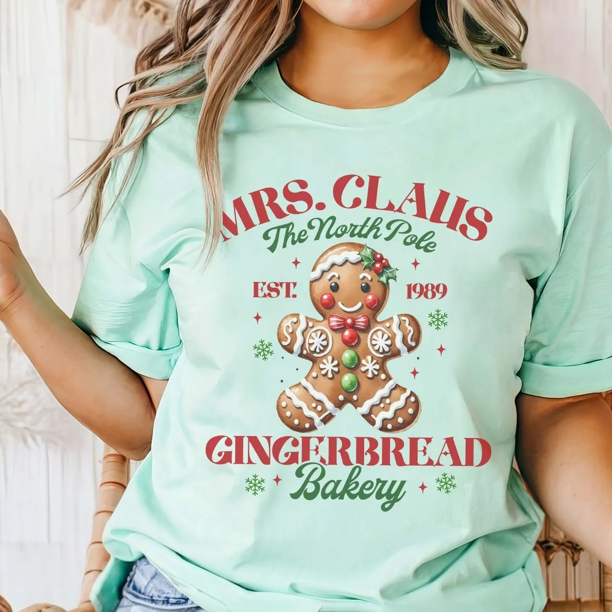 Mrs. Claus Gingerbread Bakery Wholesale Bella Graphic Tee - Fast Shipping